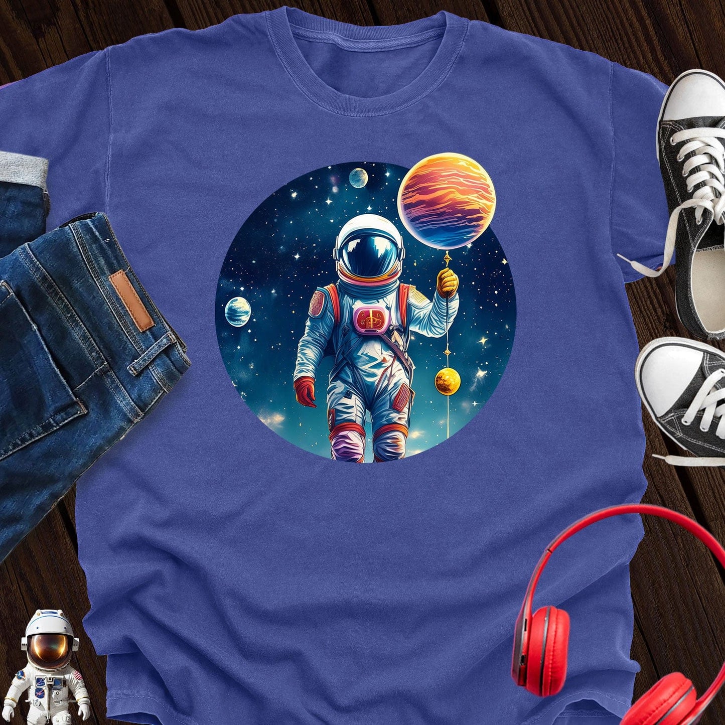 Astronaut holding Planet T-Shirt