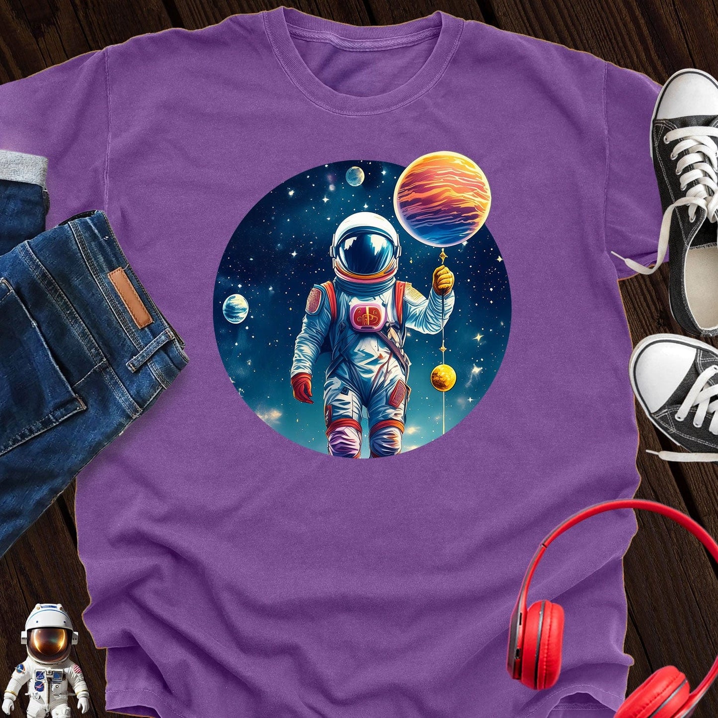 Astronaut holding Planet T-Shirt