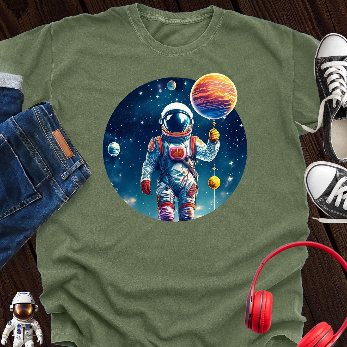 Astronaut holding Planet T-Shirt