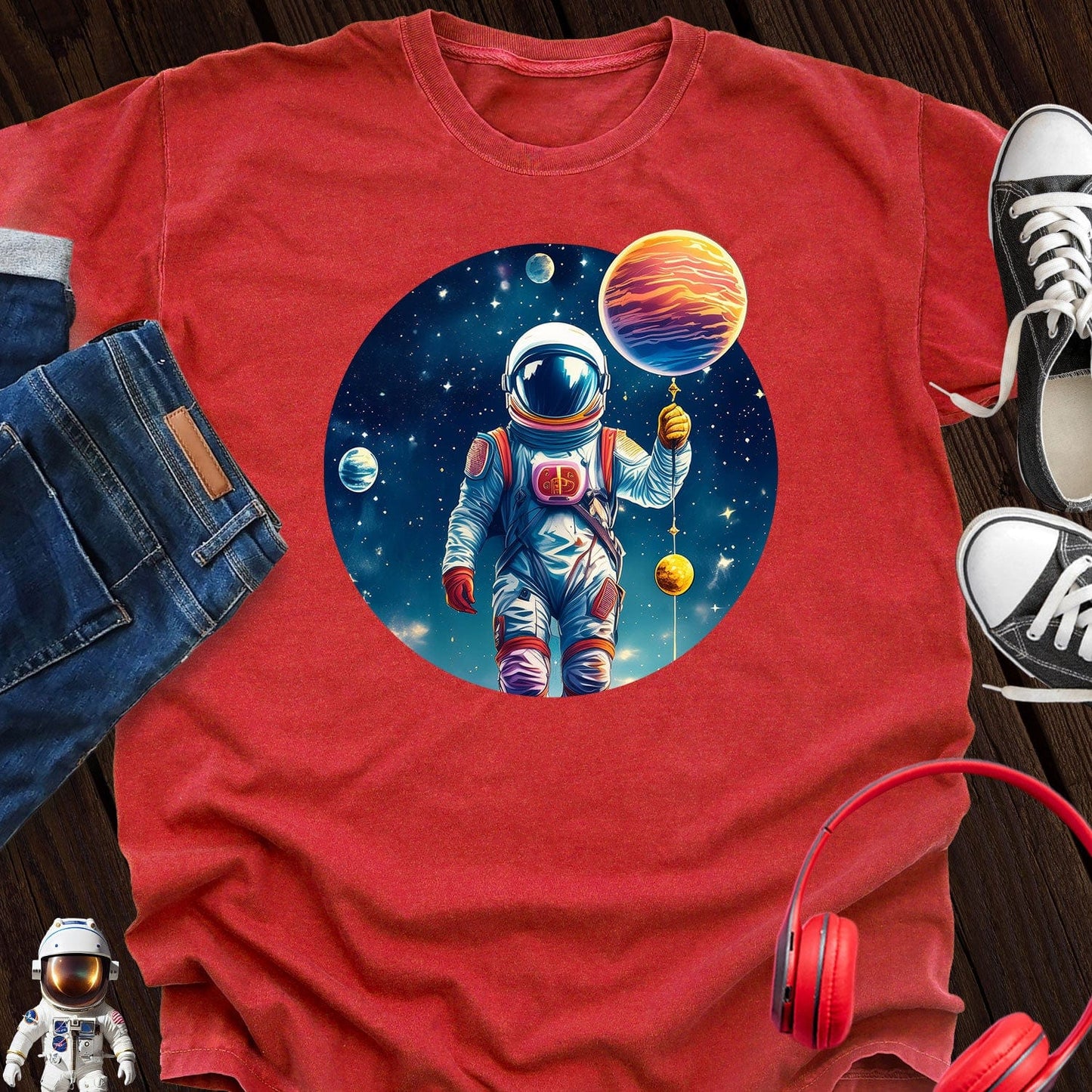 Astronaut holding Planet T-Shirt