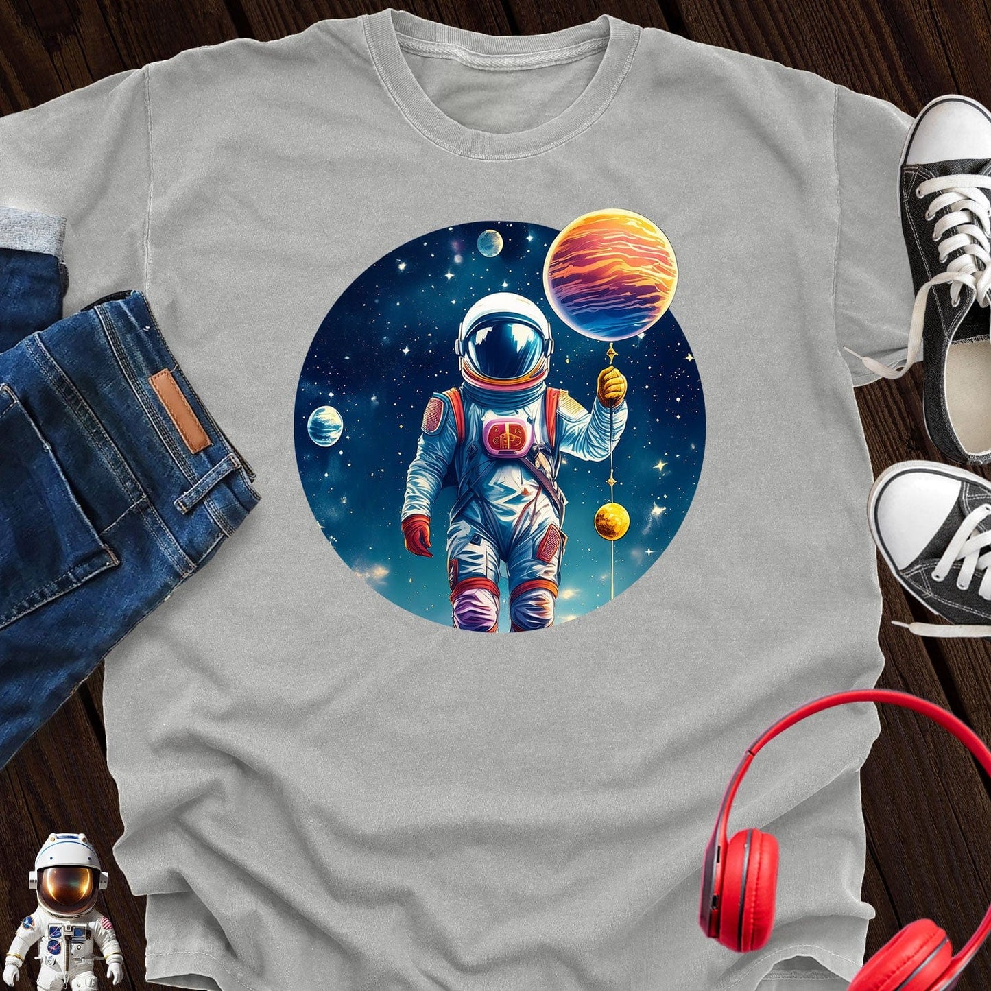 Astronaut holding Planet T-Shirt