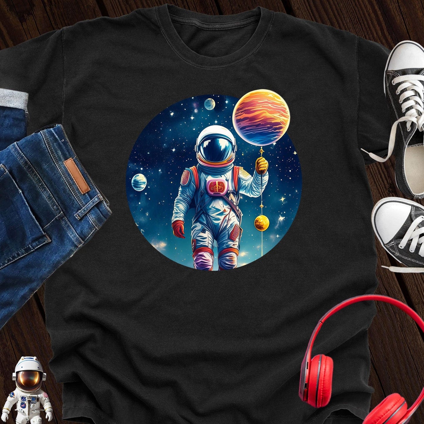 Astronaut holding Planet T-Shirt