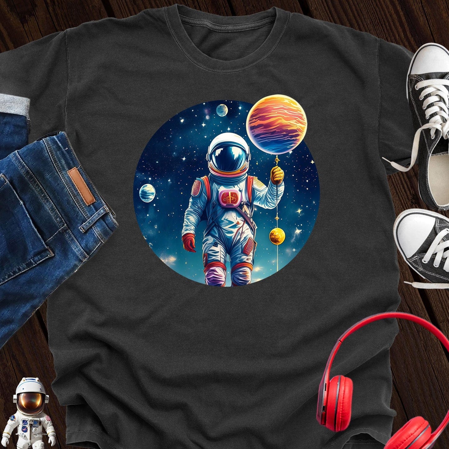 Astronaut holding Planet T-Shirt