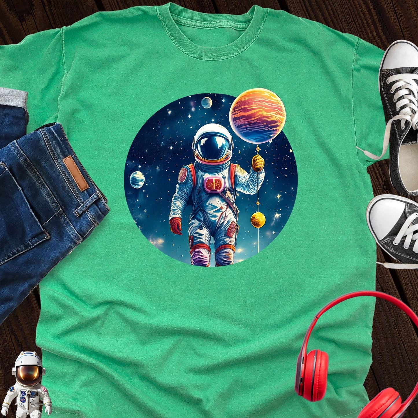 Astronaut holding Planet T-Shirt